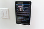 URC Total Control with an on-wall iPad controlling the lights, shades and home theater.