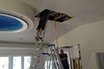 We love teamwork! There are 3 more of us in the attic getting this projector lift into position.